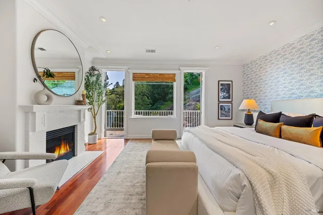 a view of a chair and table in backyard of the house