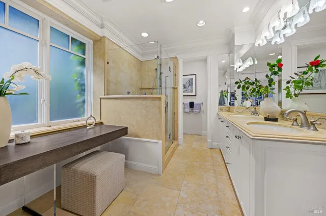 a bathroom with a sink vanity and a mirror