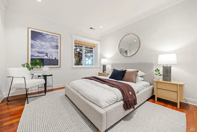 a balcony with chairs and a swing