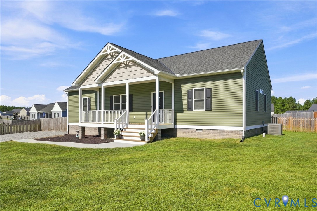 8718 Rock Cedar Road New Kent, VA 23124 - Photo 3 of 43 Green siding exterior with a covered front porch,