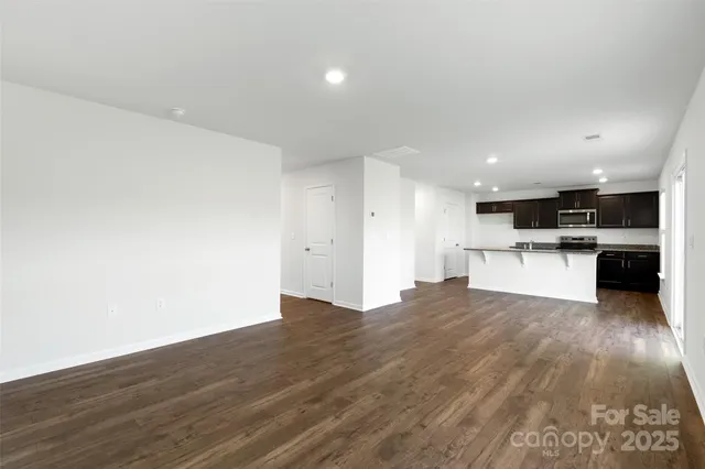 a view of kitchen with wooden floor