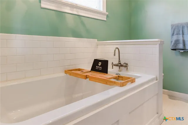 a bathroom with a sink and a bath tub