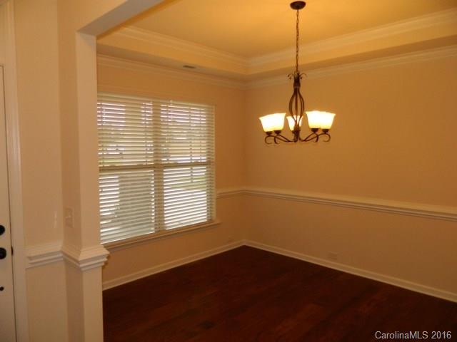 5202 Waterloo Drive, Unit CC174 Tega Cay, SC 29708 - Photo 3 of 15 a view of a room with a window and wooden floor