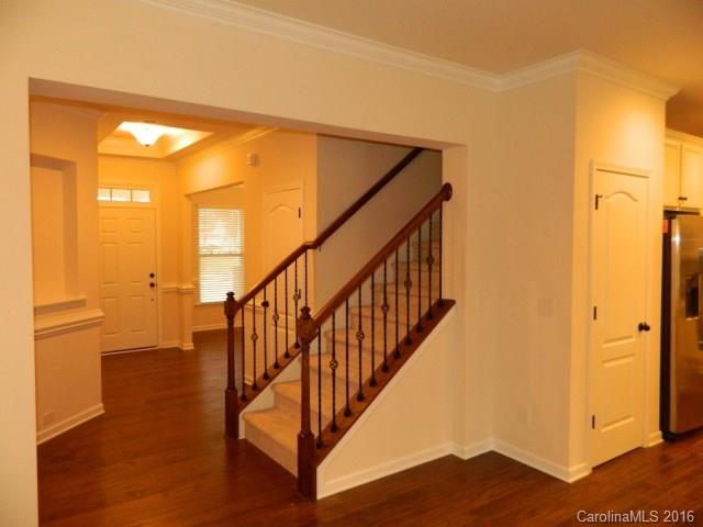 5202 Waterloo Drive, Unit CC174 Tega Cay, SC 29708 - Photo 6 of 15 a view of entryway with wooden floor and stairs