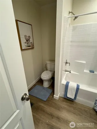 a spacious bedroom with a bed and a large window