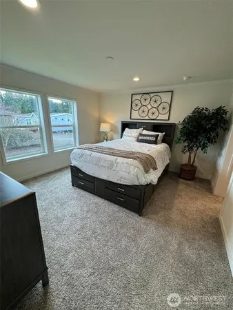 a spacious bathroom with a double vanity sink and a mirror
