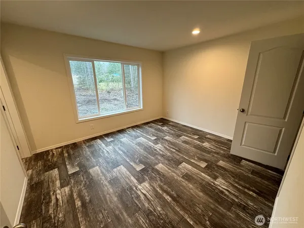 a kitchen with stainless steel appliances granite countertop a sink a stove top oven a chimney and a center island