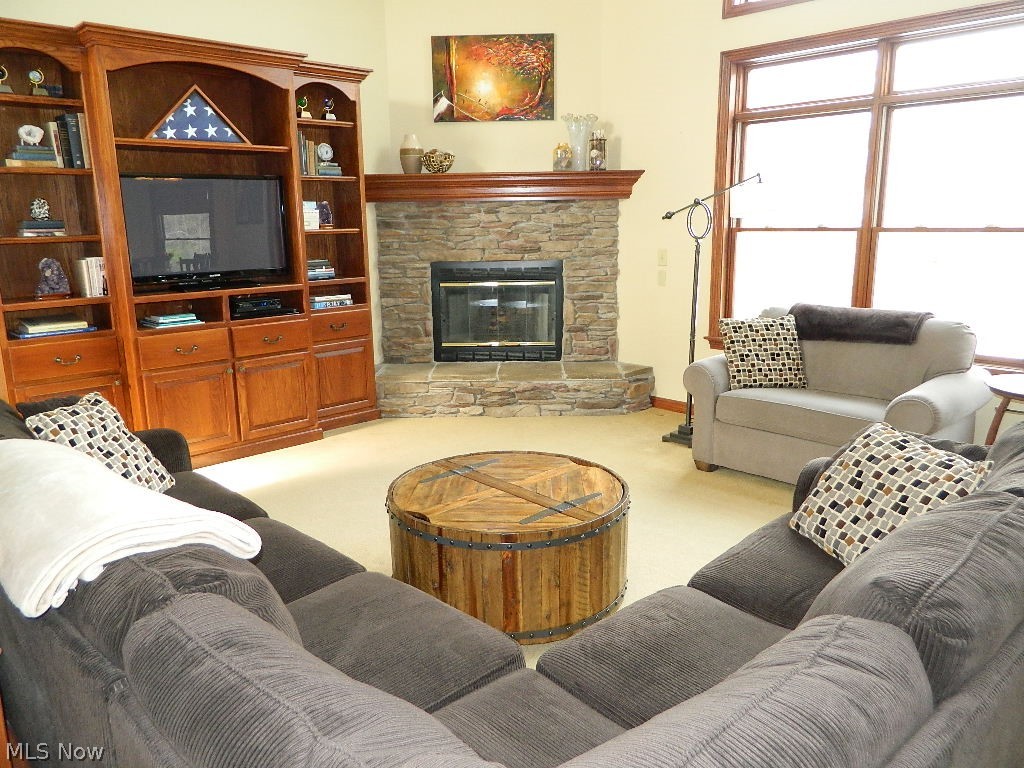 12395 Falcon Ridge Road Chesterland, OH 44026 - Photo 7 of 35 The Great Room Features Raised Hearth Stone Gas Fireplace!