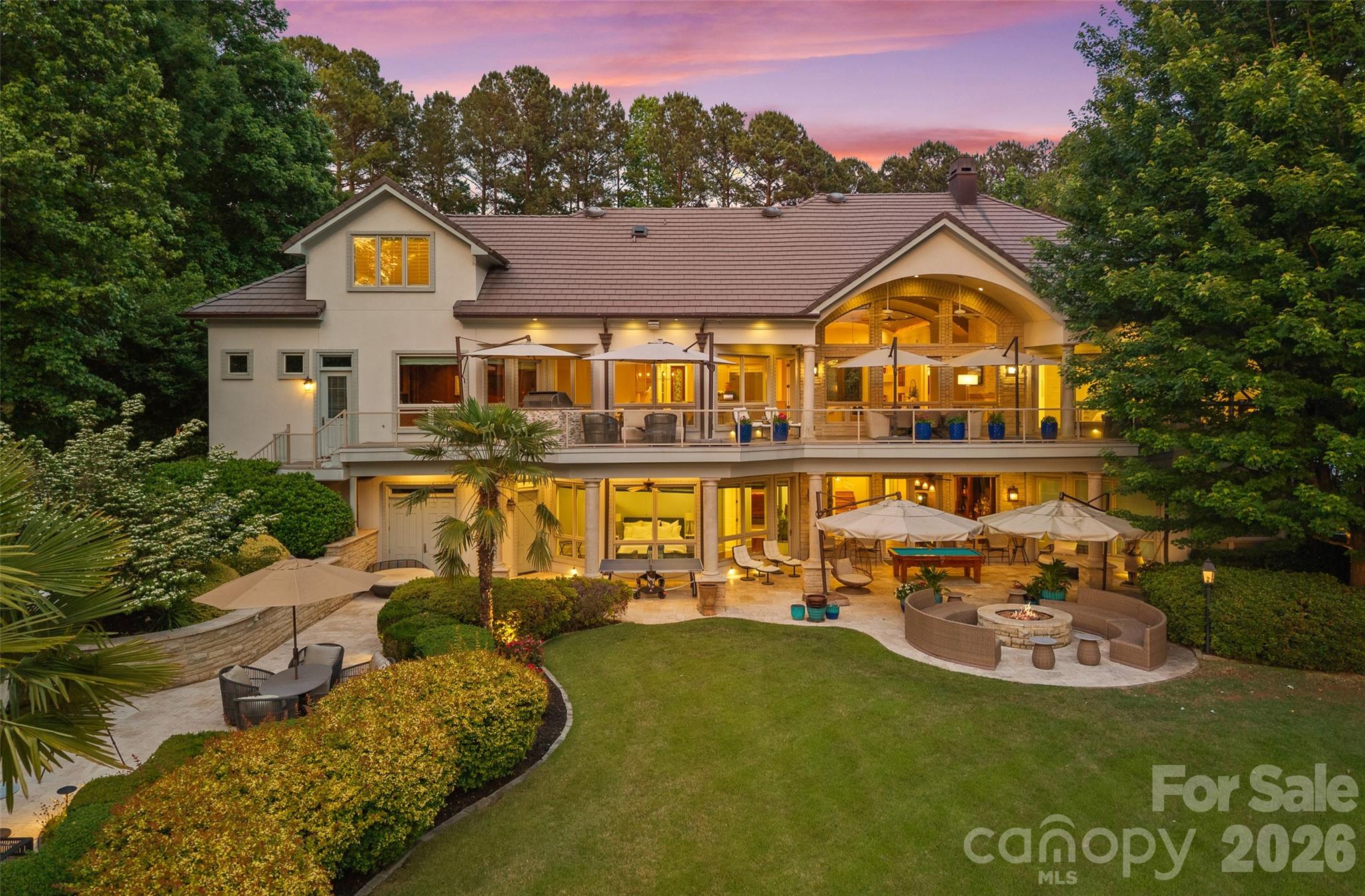 a view of a big yard with table and chairs