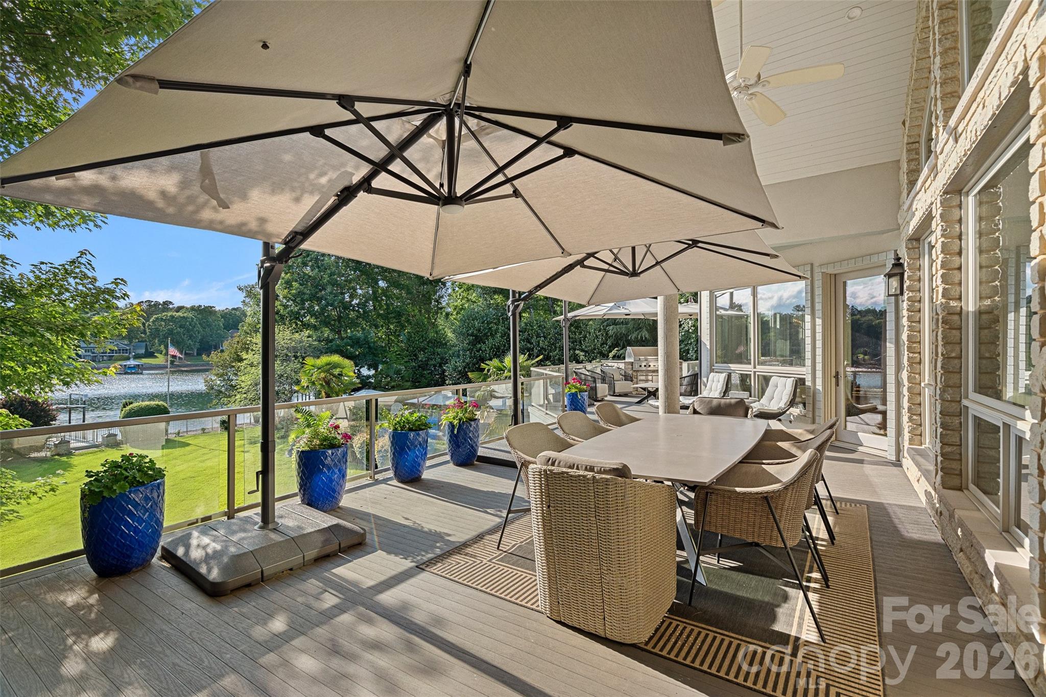 461 Kemp Road Mooresville, NC 28117 - Photo 18 of 48 a view of a patio with a dining table and chairs
