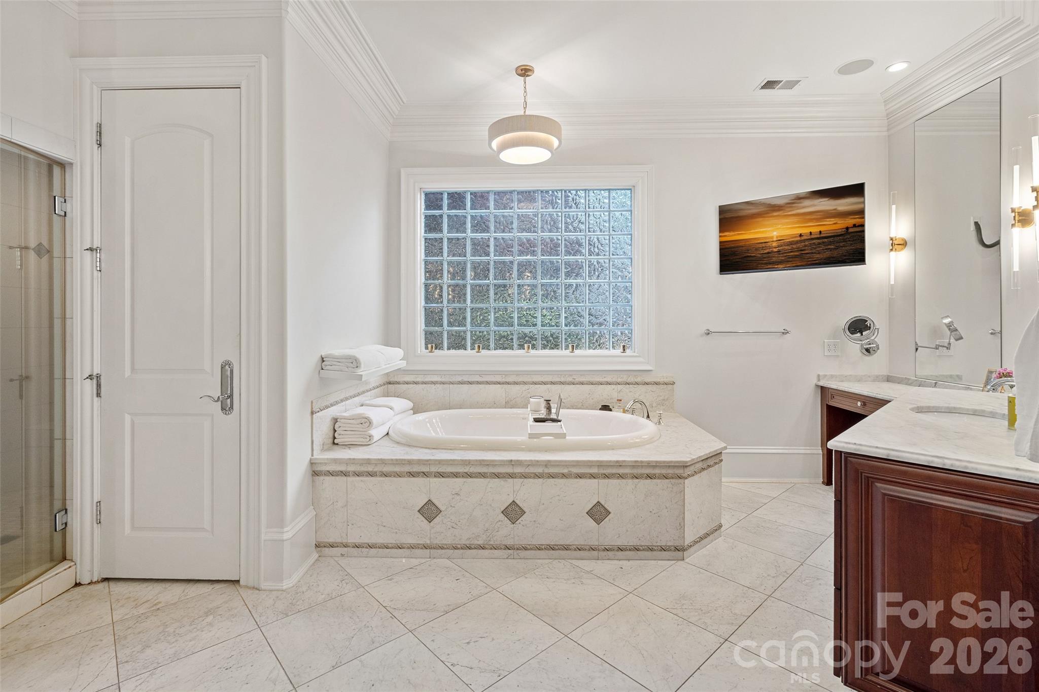 461 Kemp Road Mooresville, NC 28117 - Photo 23 of 48 a spacious bathroom with a sink a mirror and a bathtub