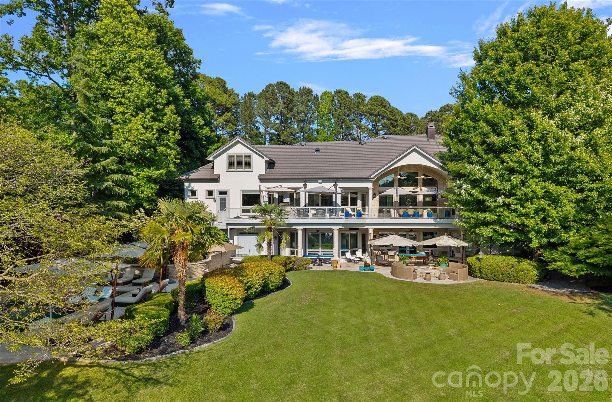 461 Kemp Road Mooresville, NC 28117 - Photo 45 of 48 a view of a white house with a big yard plants and large trees