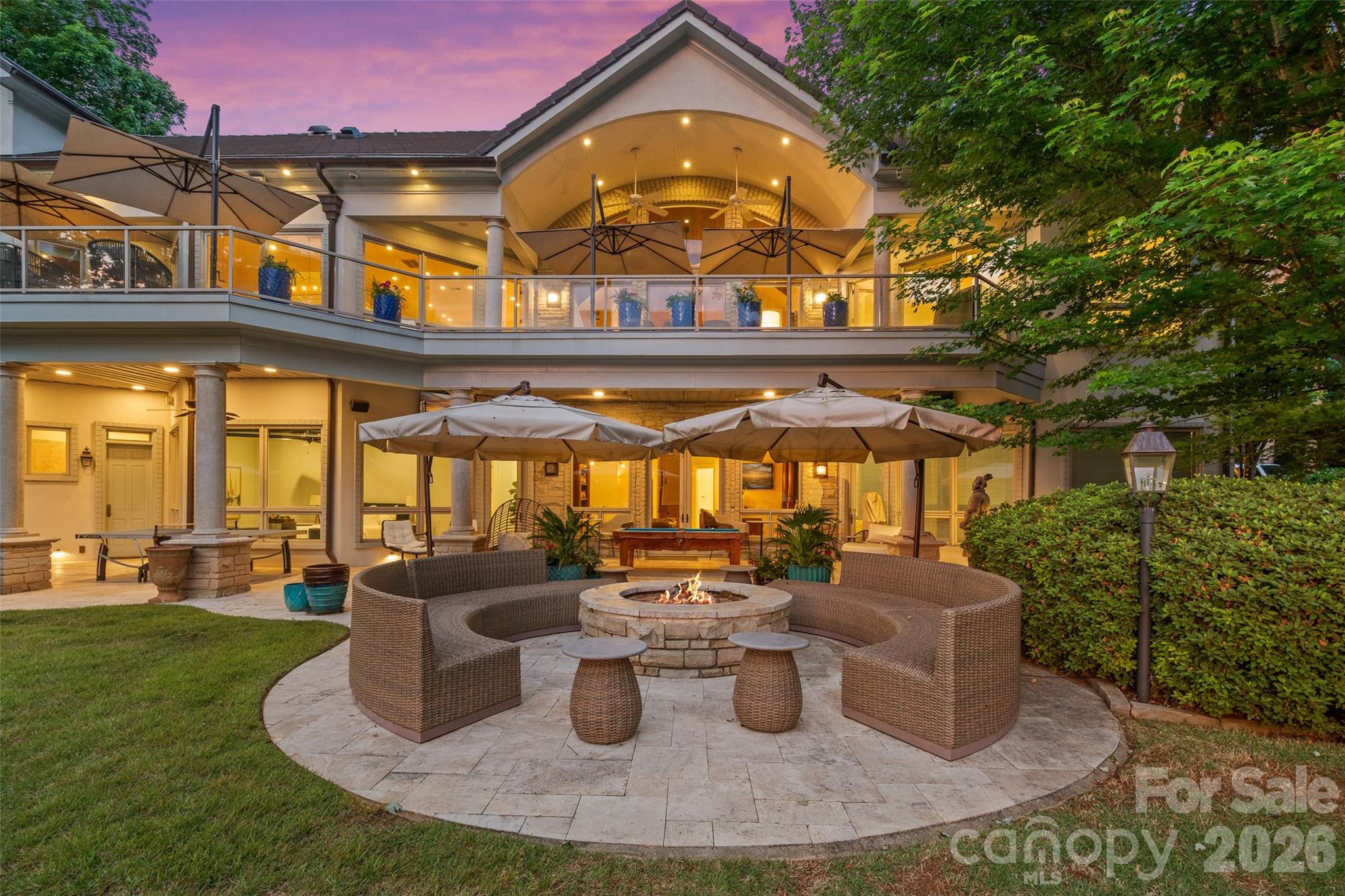 461 Kemp Road Mooresville, NC 28117 - Photo 6 of 48 a view of a patio with table and chairs potted plants and a large tree
