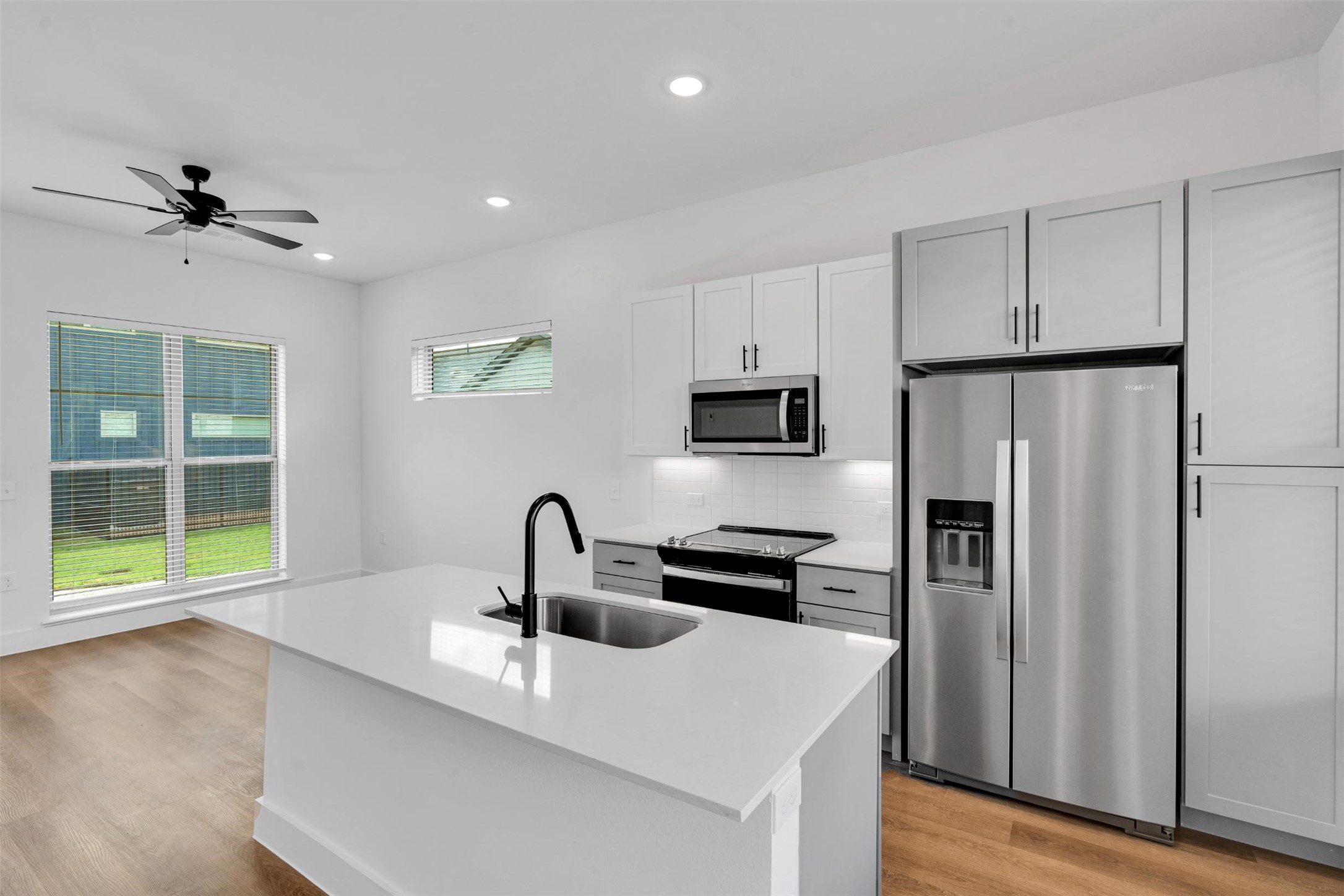 1748 Labrador Lane Garland, TX 75040 - Photo 4 of 27 a kitchen with stainless steel appliances a sink stove and refrigerator