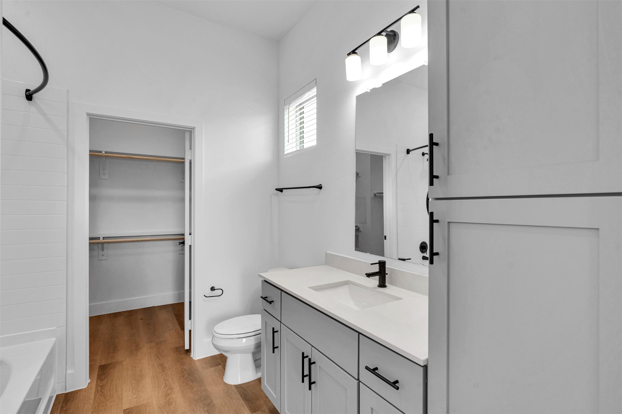 1748 Labrador Lane Garland, TX 75040 - Photo 10 of 27 a bathroom with a sink toilet and shower