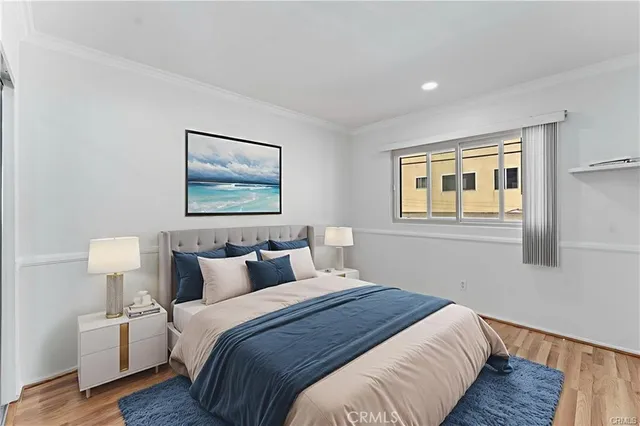 a bedroom with bed and night stand