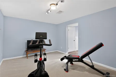 a view of a workspace with gym equipment