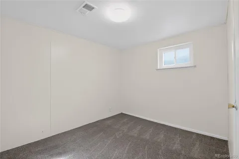 an empty room with a empty space and window
