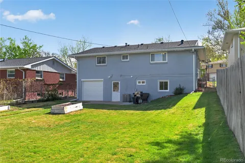 a view of a house with a yard and plants