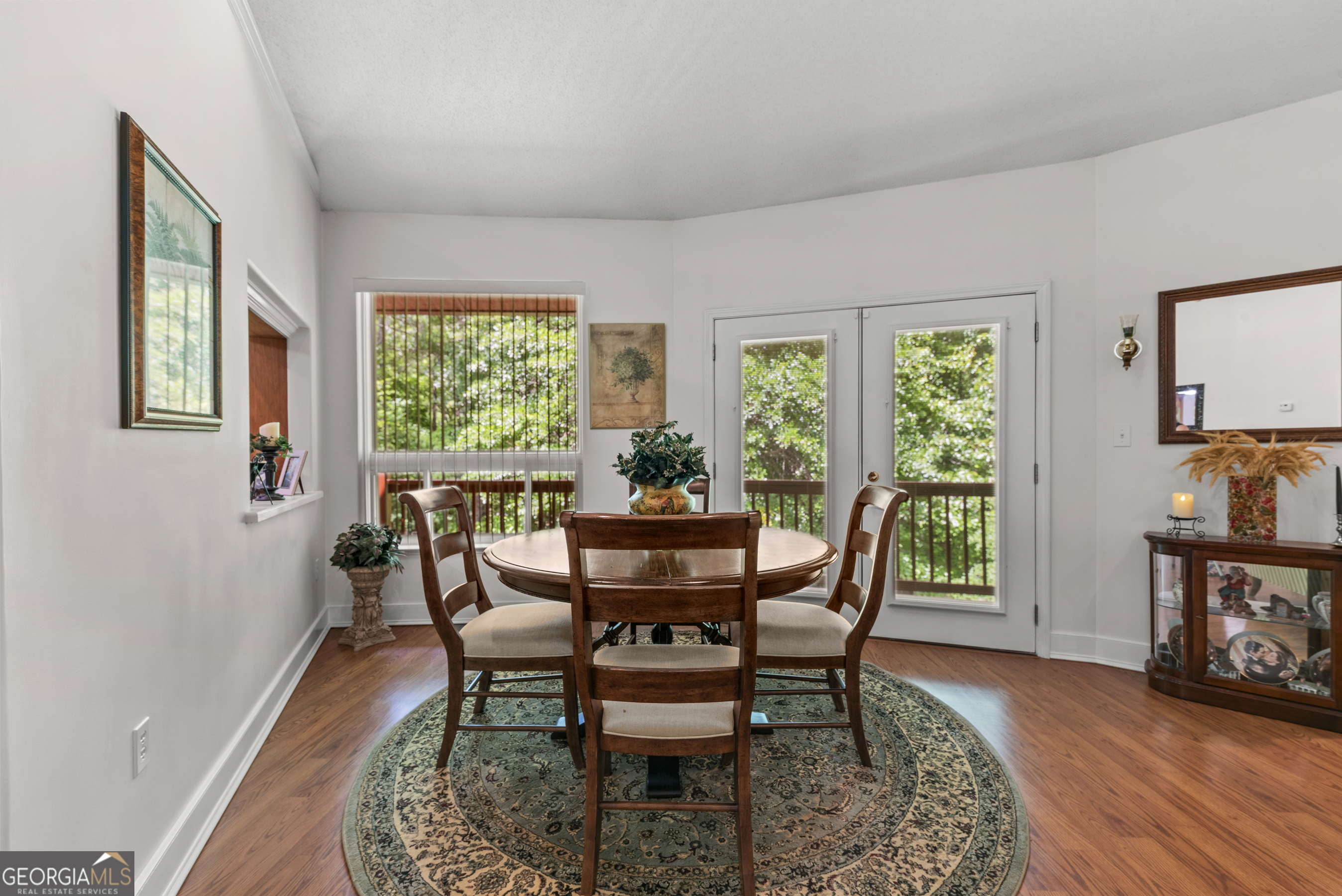 1170 Cedar Grove Road Buckhead, GA 30625 - Photo 12 of 51 a dining room with furniture a rug and wooden floor