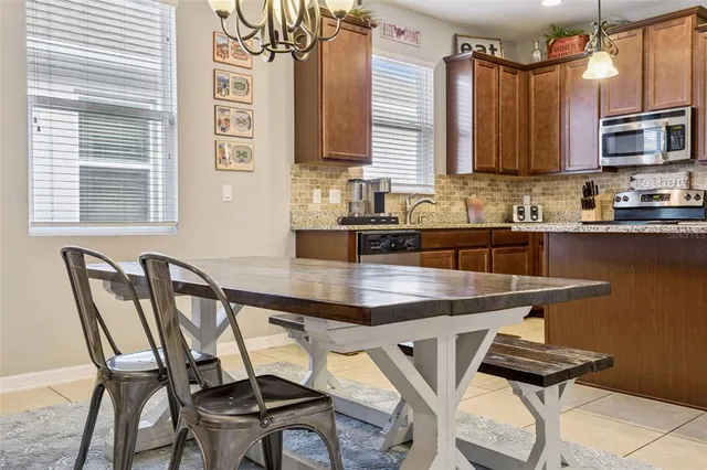 a living room with furniture a rug and a wall painting