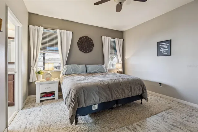 a en suite bathroom with a double vanity sink and a mirror