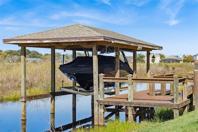 a view of a lake with houses in the back