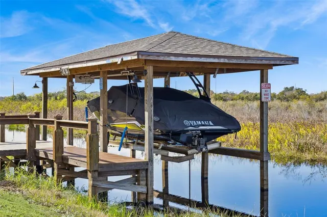 a view of a lake with a house in the background