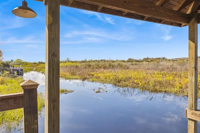 a view of a lake with houses in the background