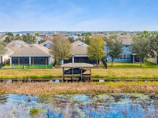 a view of lake with residential houses with outdoor space and ocean view