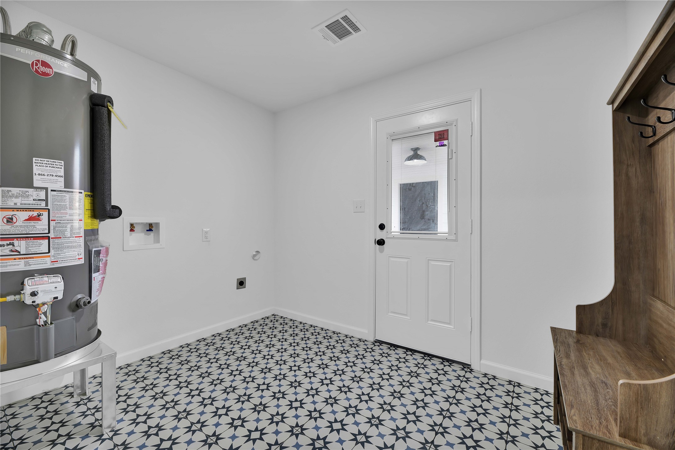 2726 Stetson Lane Houston, TX 77043 - Photo 20 of 36 Convenient laundry space/mud-room with plenty of storage and tile for functional living.