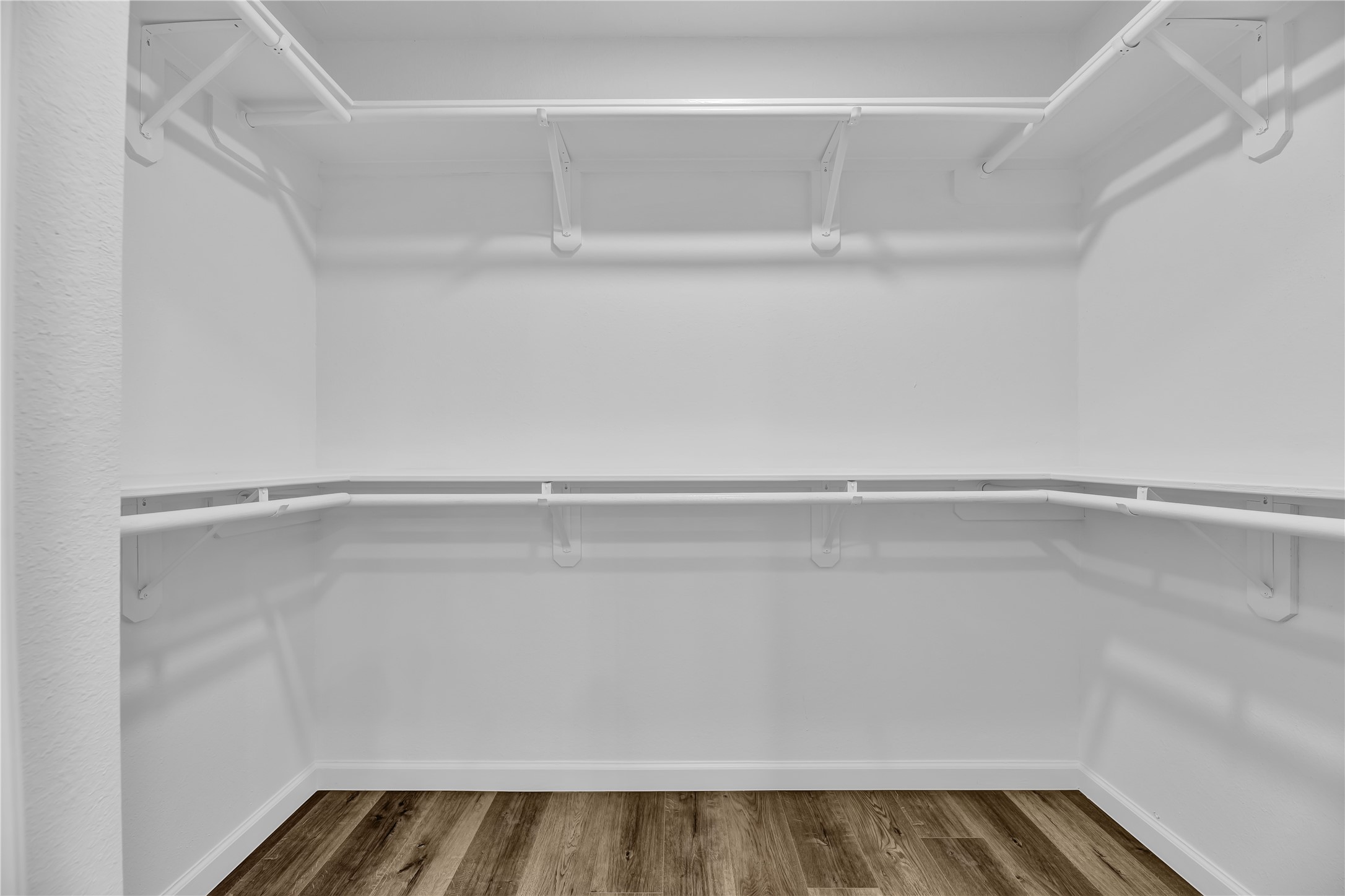 2726 Stetson Lane Houston, TX 77043 - Photo 27 of 36 Large walk-in primary closet with ample storage and clean, organized design