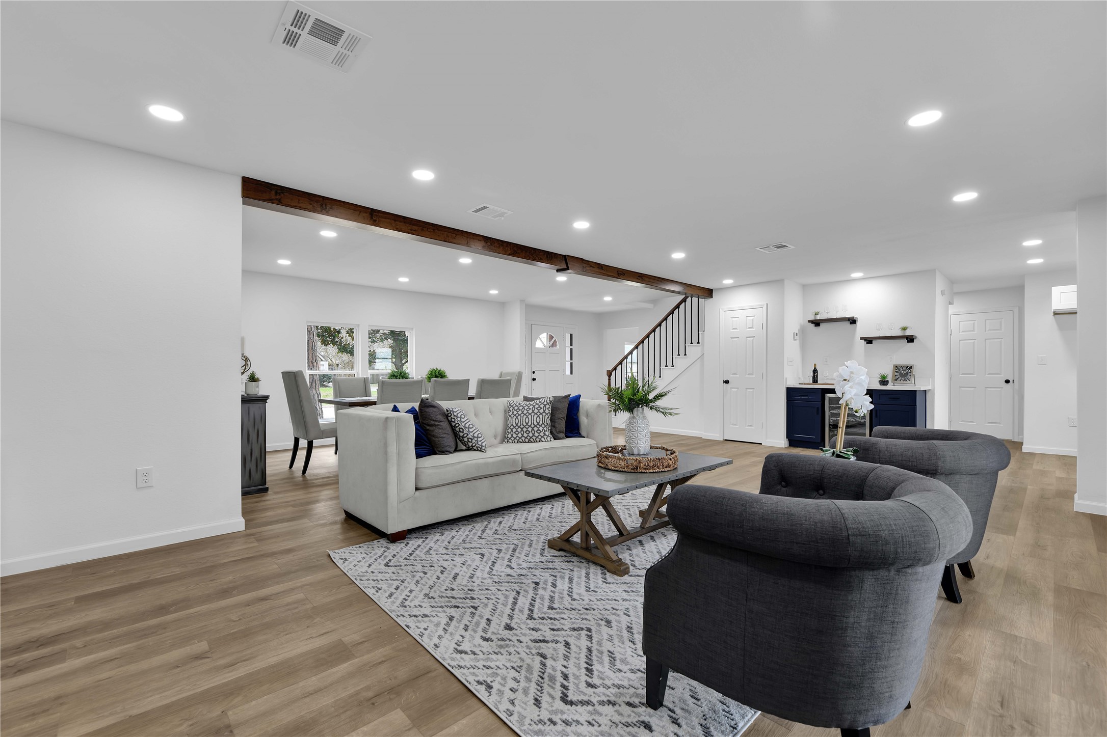 2726 Stetson Lane Houston, TX 77043 - Photo 9 of 36 Notice the wood beam that brings warmth and charm to this inviting open living area.