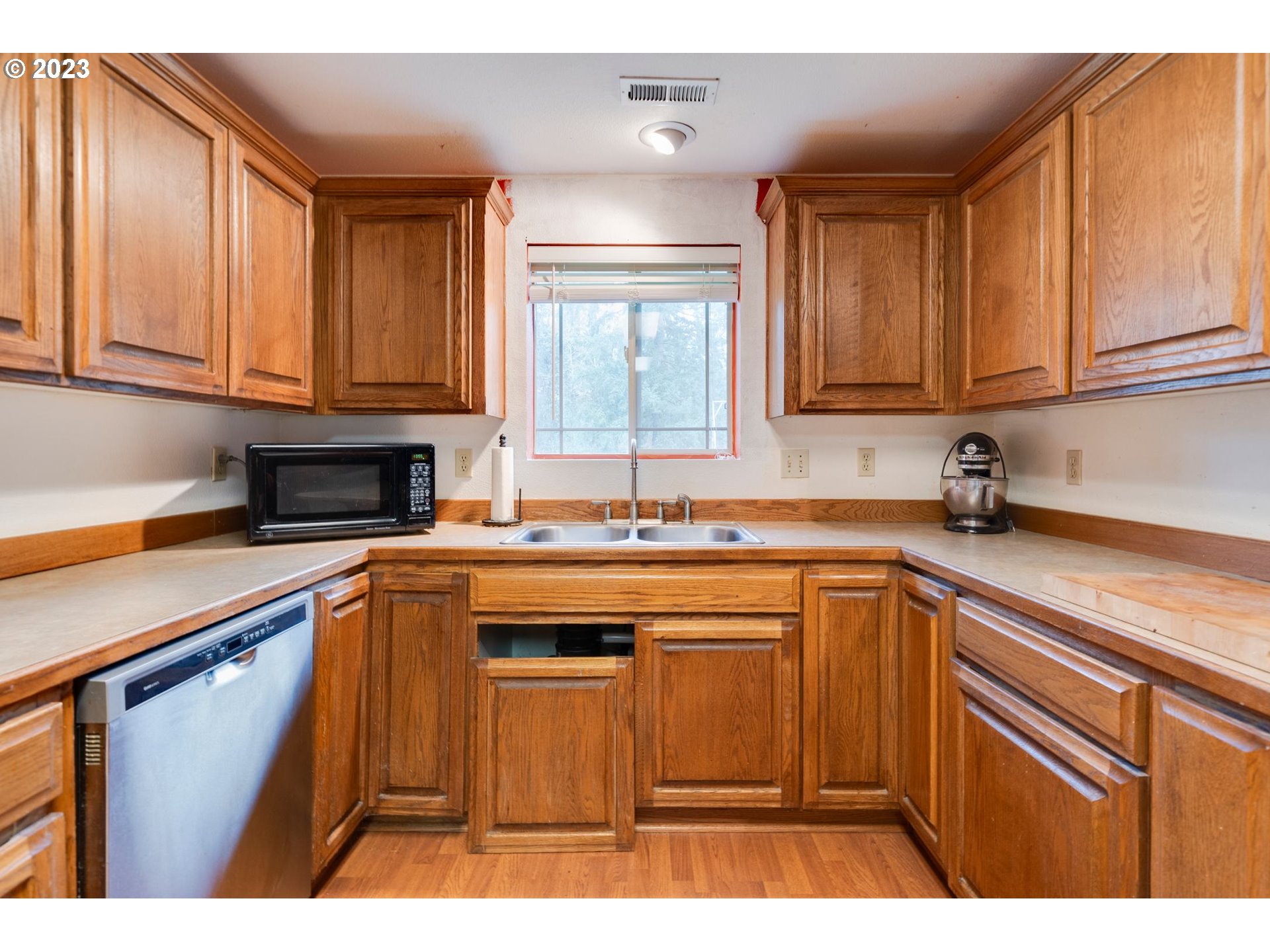 17802 Northeast 219th Street Battle Ground, WA 98604 - Photo 12 of 42 a kitchen with stainless steel appliances granite countertop a sink stove and cabinets