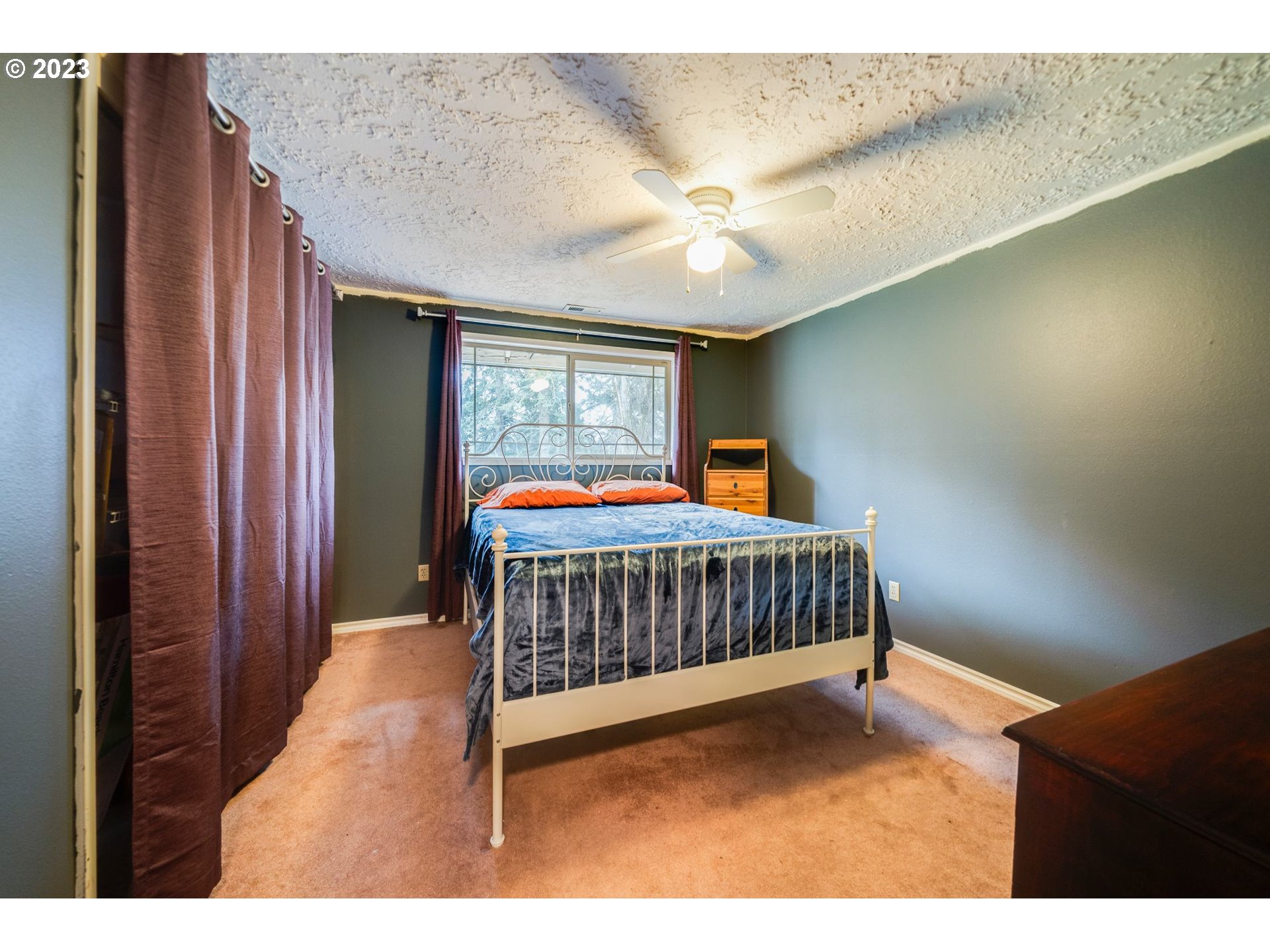 17802 Northeast 219th Street Battle Ground, WA 98604 - Photo 17 of 42 a bedroom with a bed and window