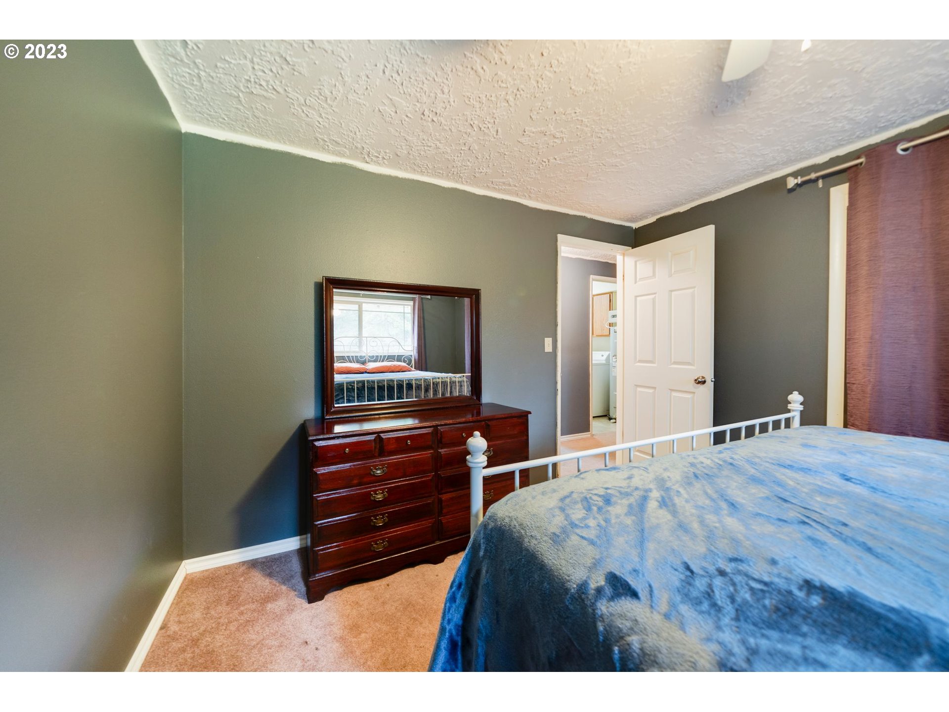 17802 Northeast 219th Street Battle Ground, WA 98604 - Photo 18 of 42 a bed room with a bed and a television