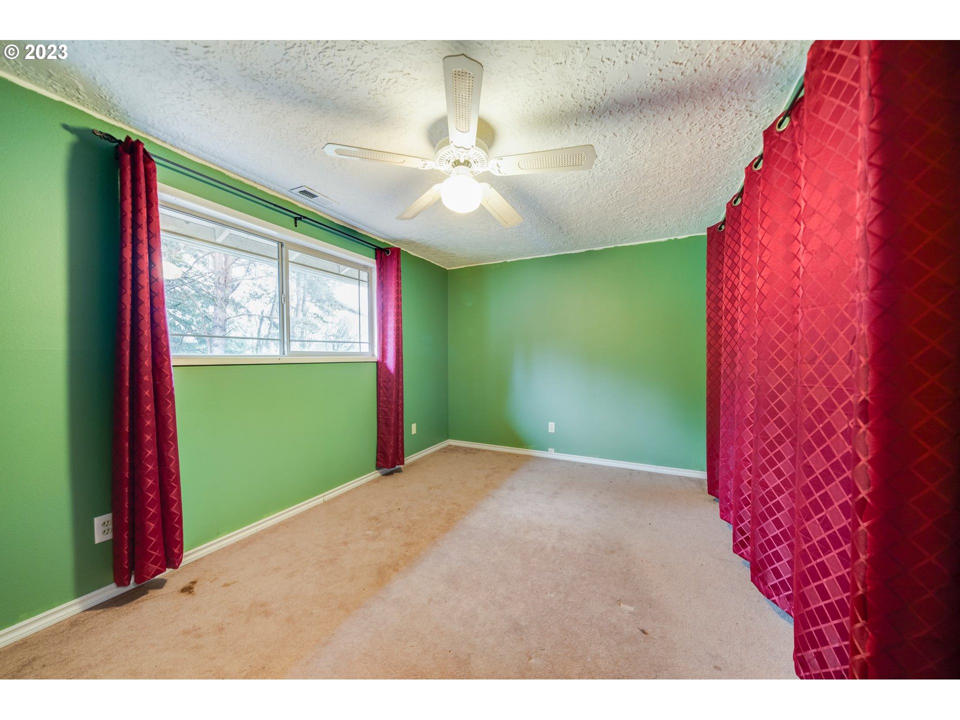 17802 Northeast 219th Street Battle Ground, WA 98604 - Photo 19 of 42 a view of an empty room with a window