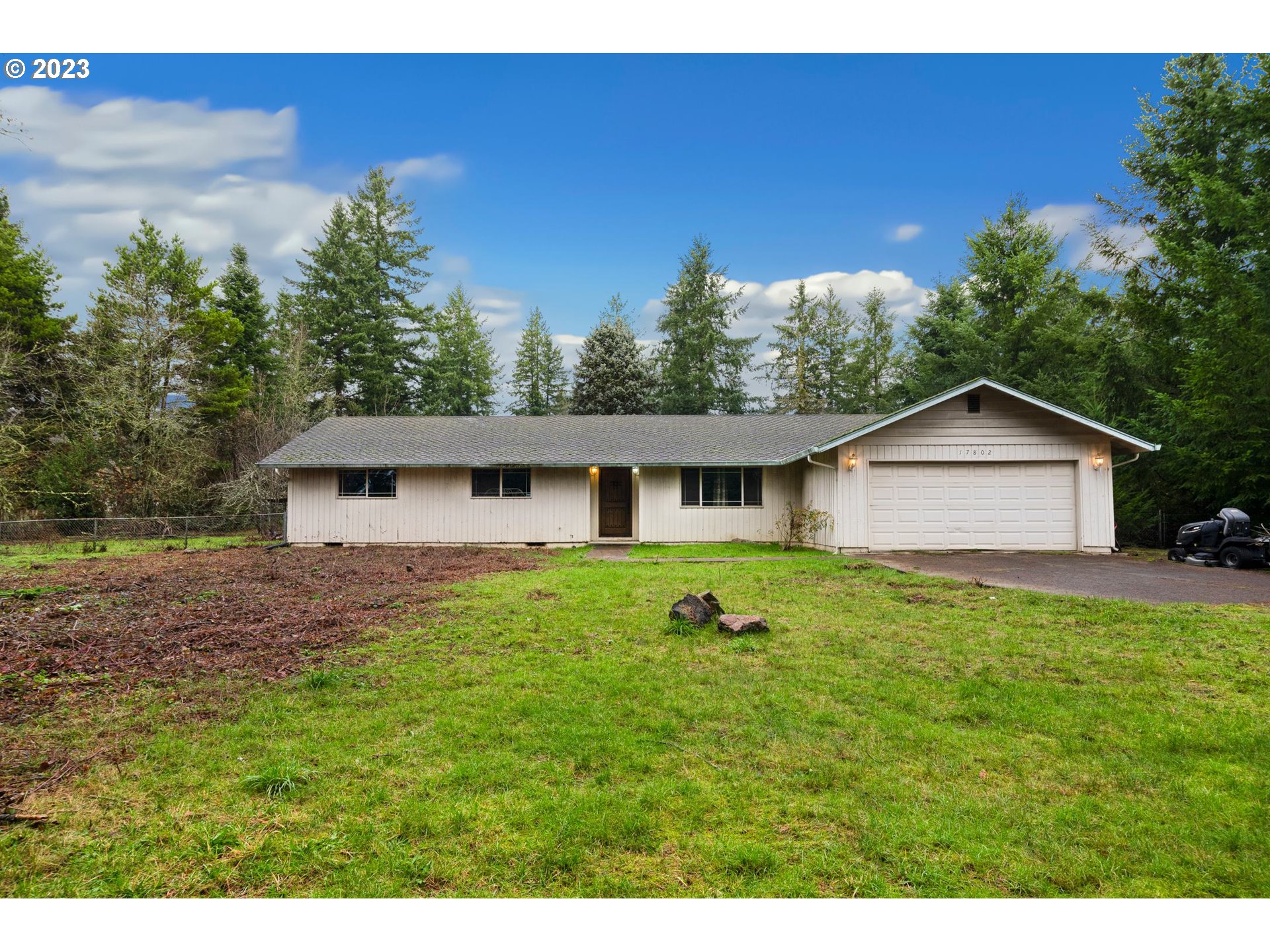 17802 Northeast 219th Street Battle Ground, WA 98604 - Photo 2 of 42 a front view of a house with garden