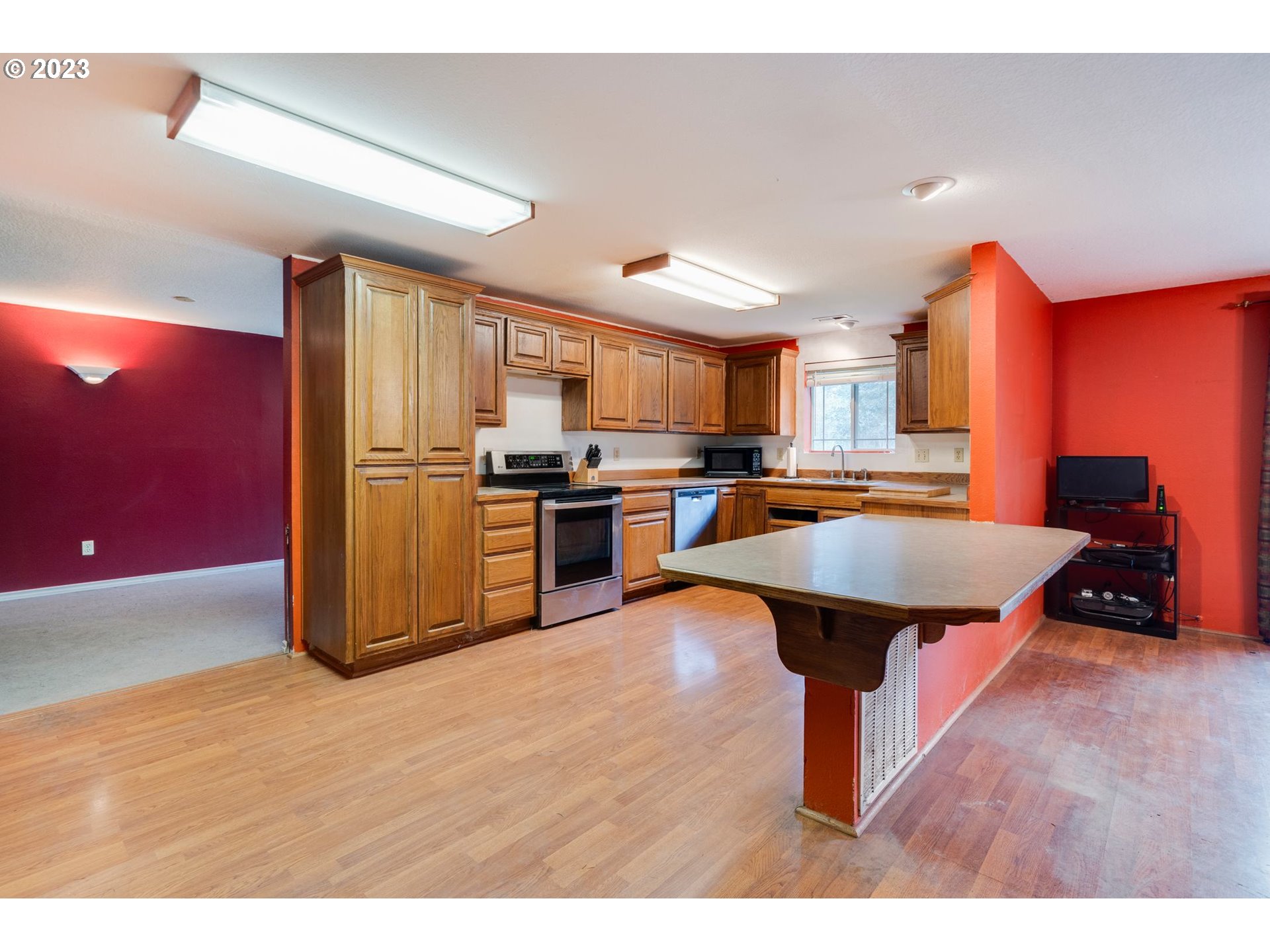 17802 Northeast 219th Street Battle Ground, WA 98604 - Photo 10 of 42 a kitchen with stainless steel appliances a stove a refrigerator and a sink