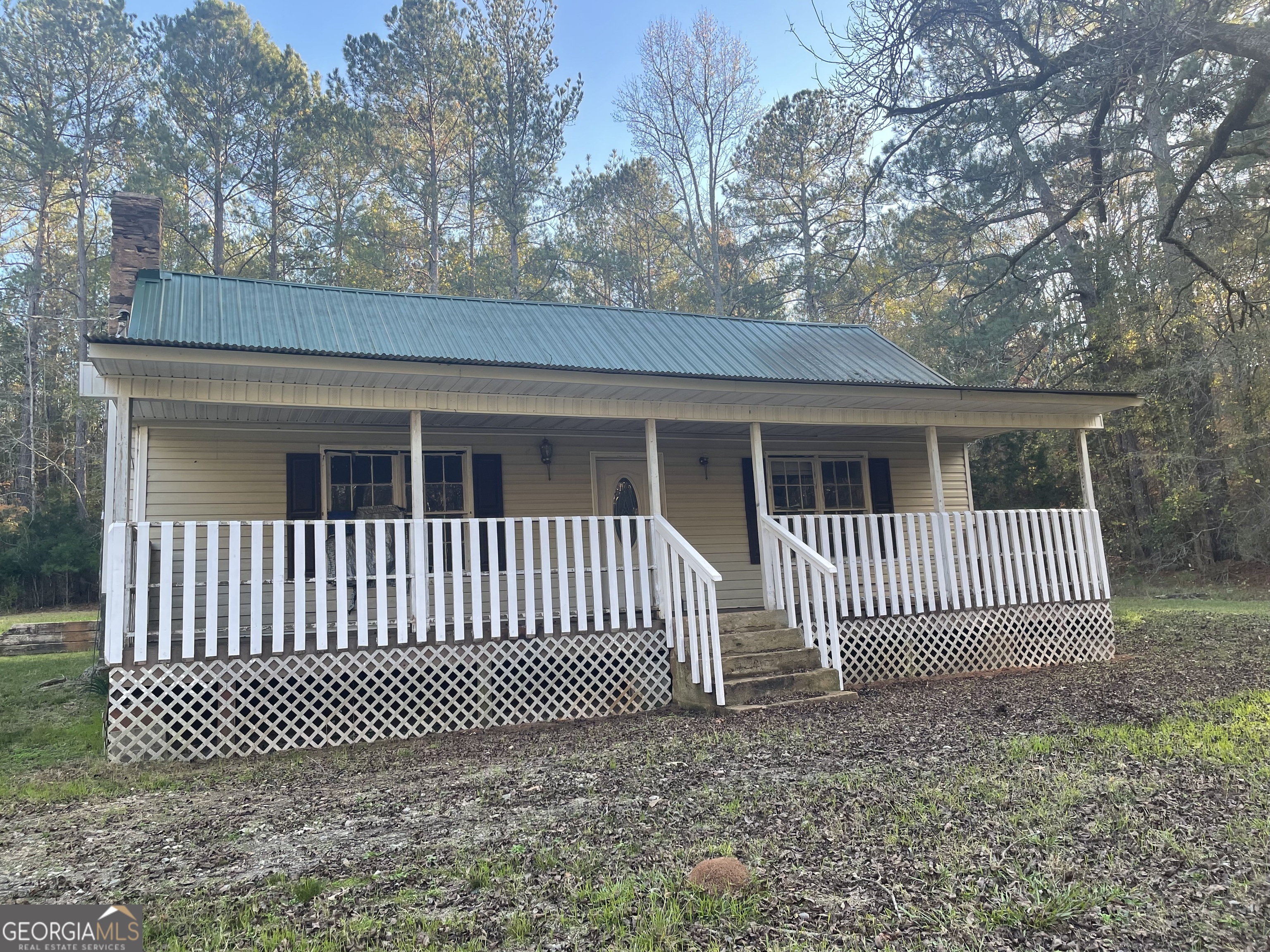 216 Cork Road Flovilla, GA 30216 - Photo 1 of 1 a view of a house with a gate