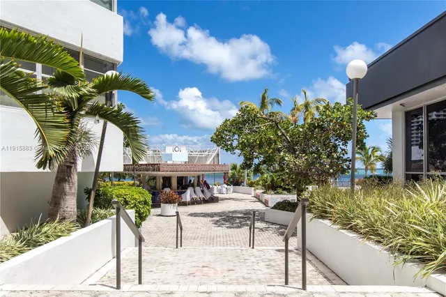 a view of a swimming pool with a table and chairs