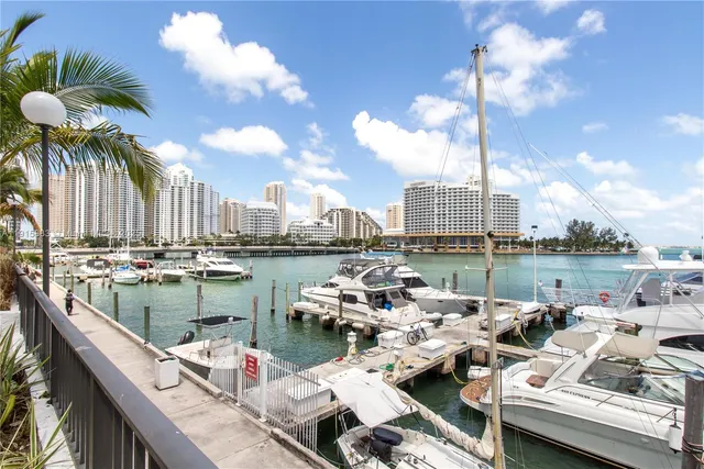 a table and chairs sitting in front of a lake view