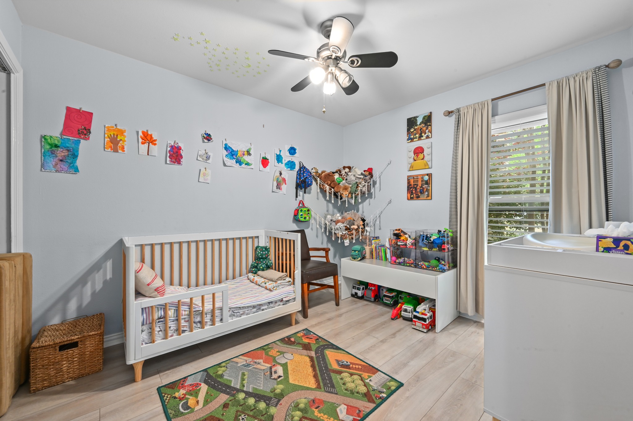 2509 Redleaf Lane Austin, TX 78745 - Photo 14 of 28 Light-toned wood-finish flooring complements the neutral wall color