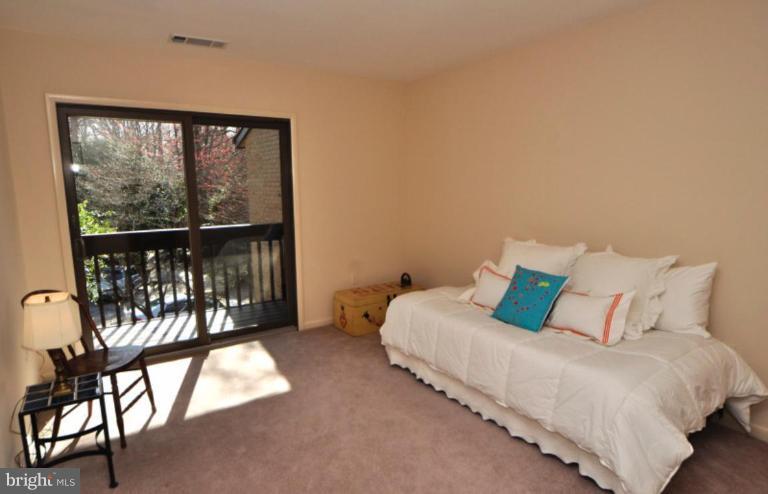 2004 Lakebreeze Way Reston, VA 20191 - Photo 7 of 30 BEDROOM #2 FEATURES A SLIDING GLASS DOOR & BALCONY