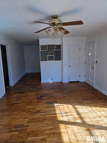 a view of a livingroom with wooden floor