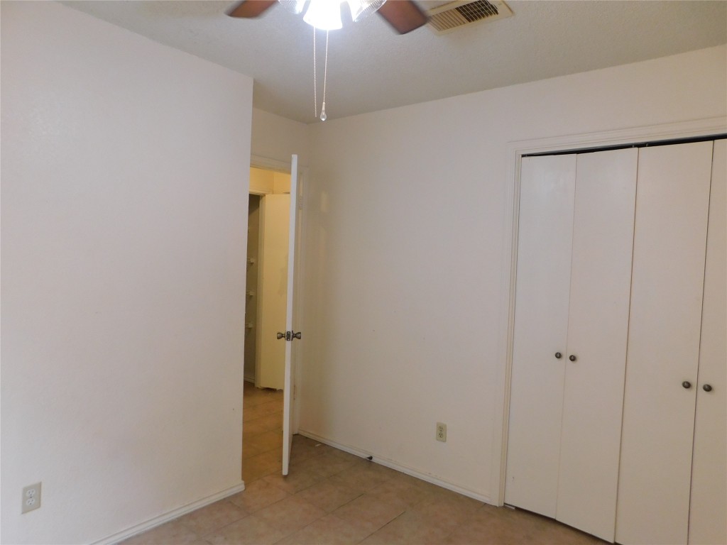 2027 Redwing Way Round Rock, TX 78664 - Photo 12 of 13 an empty room with a empty space and a ceiling fan