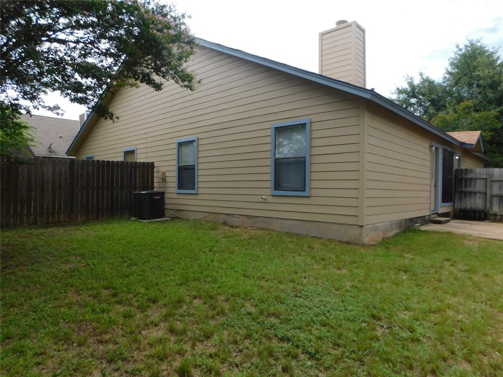 2027 Redwing Way Round Rock, TX 78664 - Photo 13 of 13 a view of a backyard with plants and large tree