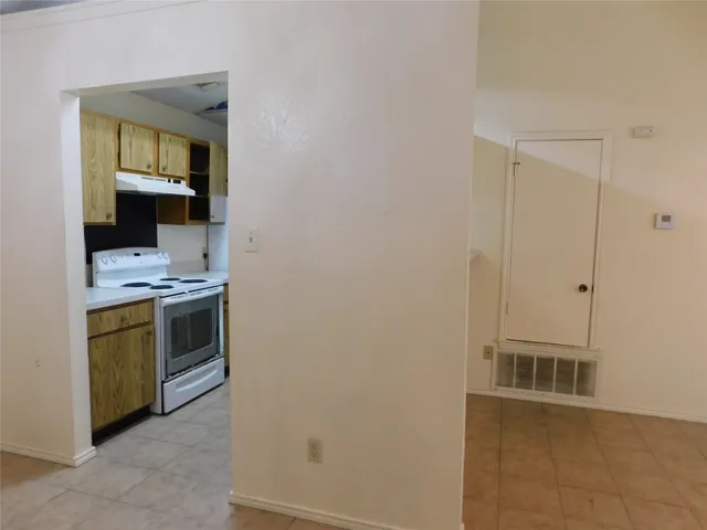 a view of a kitchen with a sink