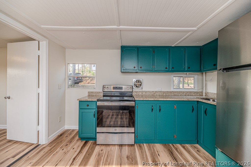 161 White Oak Street Carthage, NC 28327 - Photo 15 of 29 a kitchen with wooden cabinets and a sink