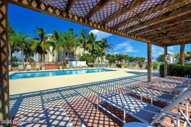 a view of a swimming pool with a patio